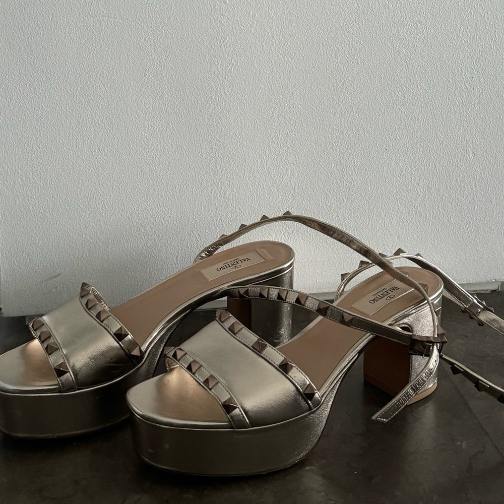 Valentino women’s gold studded platform sandals.
